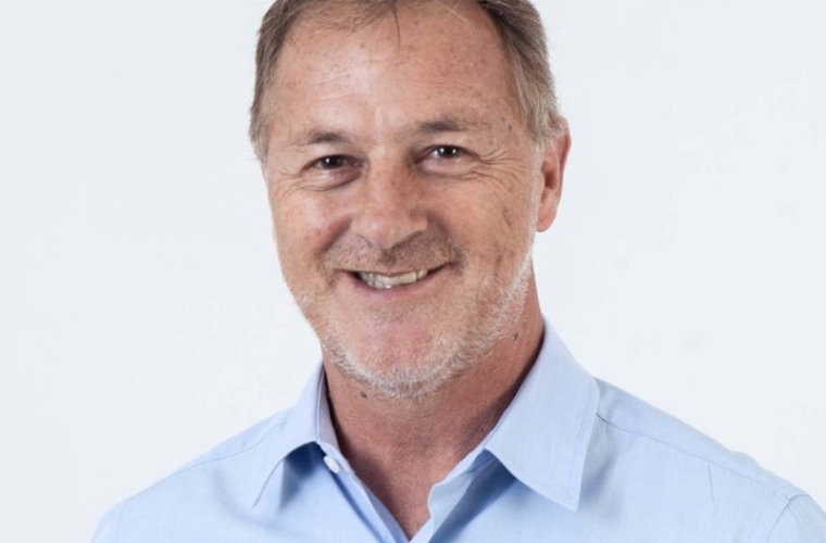 Retrato sonriente de Jorge Muñoz Wells, abogado